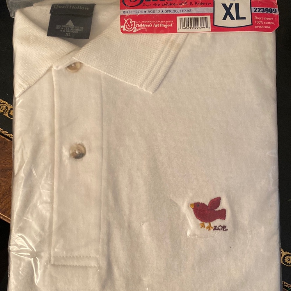 White polo Tx Children’s Art Project shirt